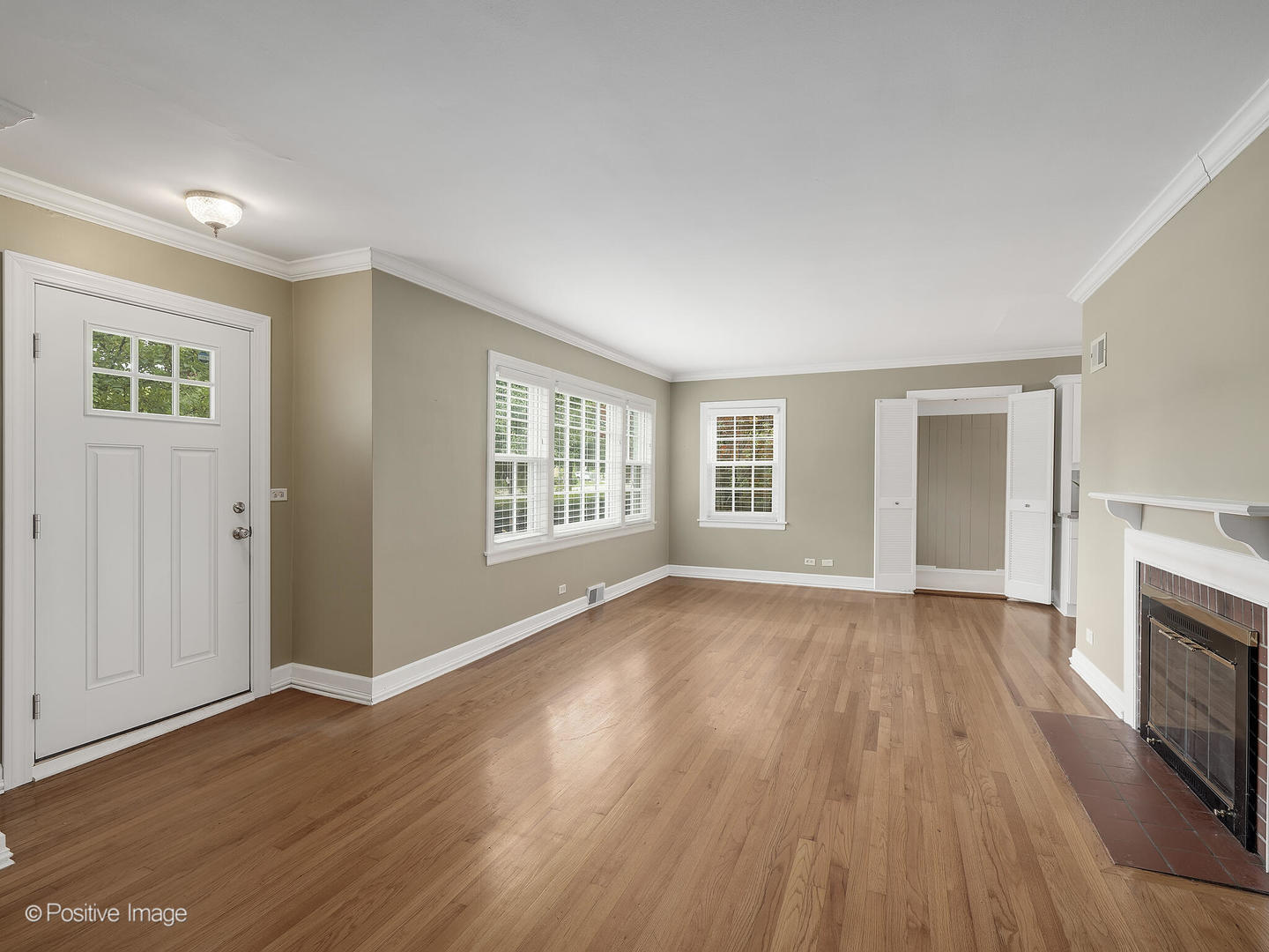 337 Wagner Road Northfield, IL 60093 - Photo 2 of 22 an empty room with wooden floor and windows