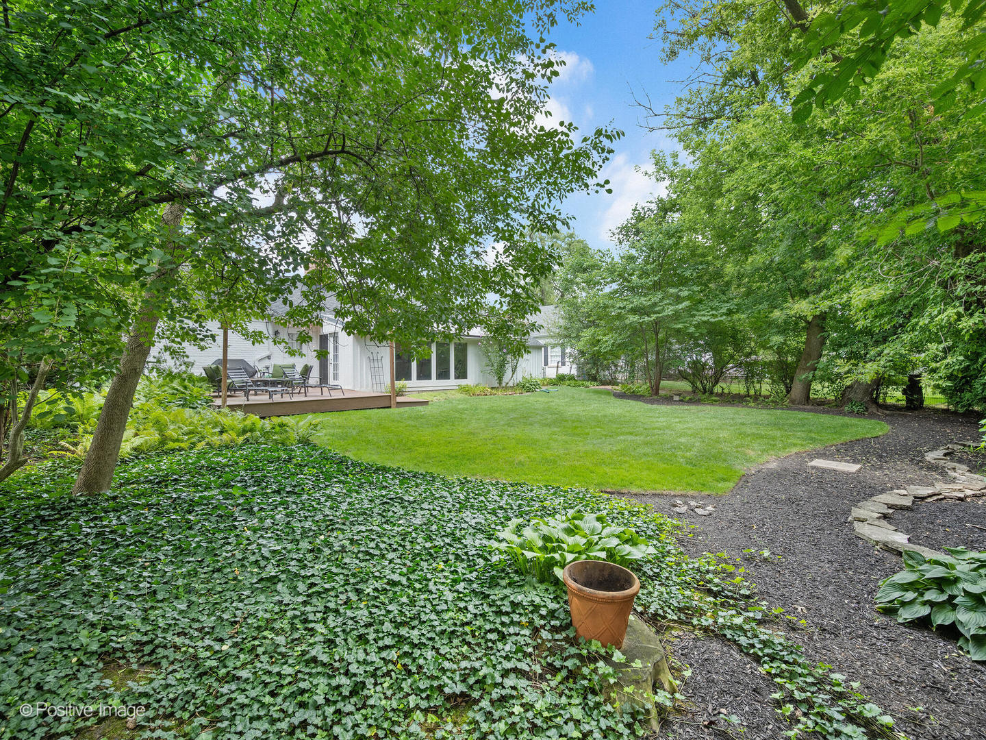 337 Wagner Road Northfield, IL 60093 - Photo 22 of 22 a view of a garden with a fountain
