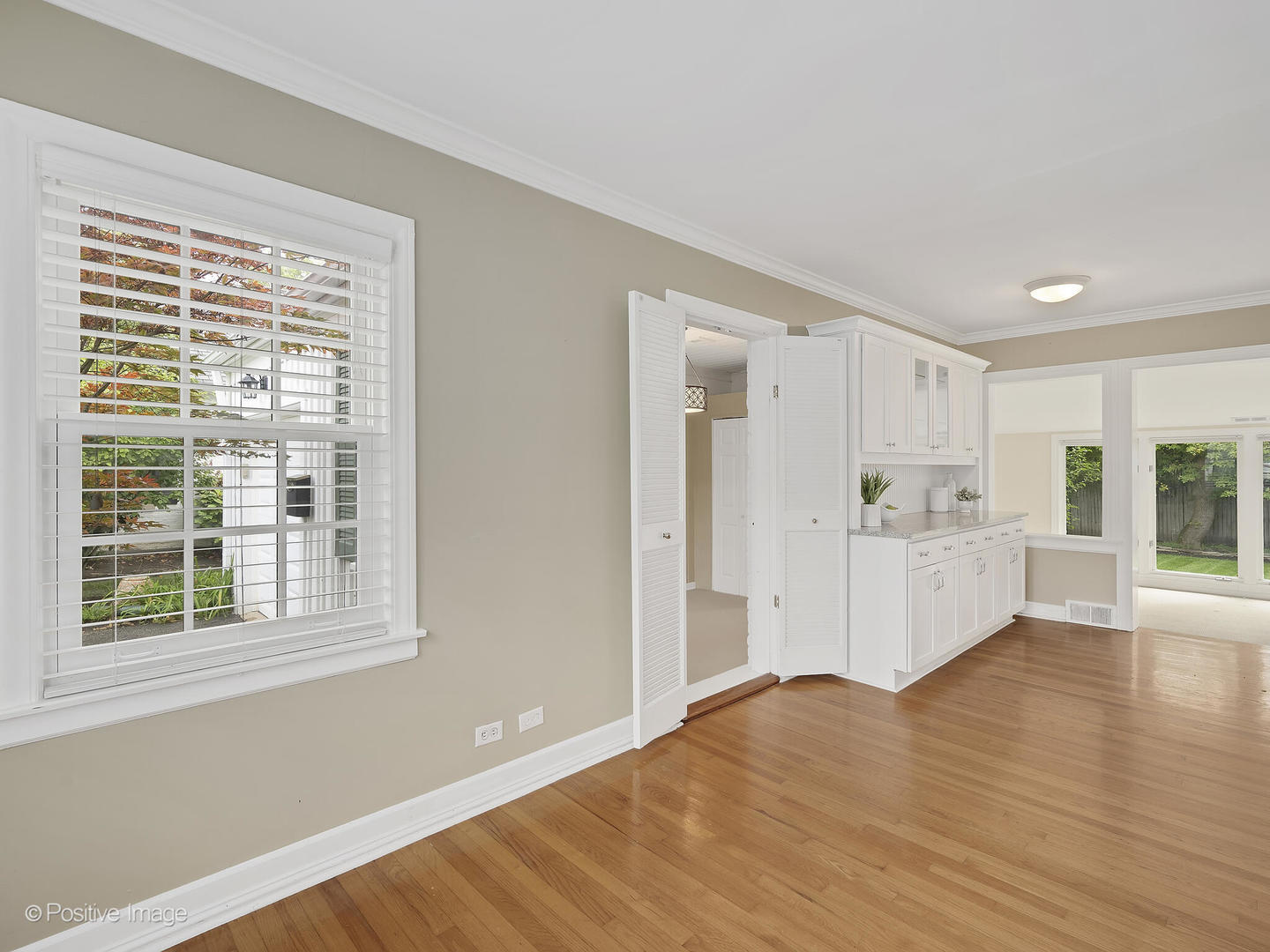 337 Wagner Road Northfield, IL 60093 - Photo 6 of 22 a view of a kitchen with wooden floor and windows