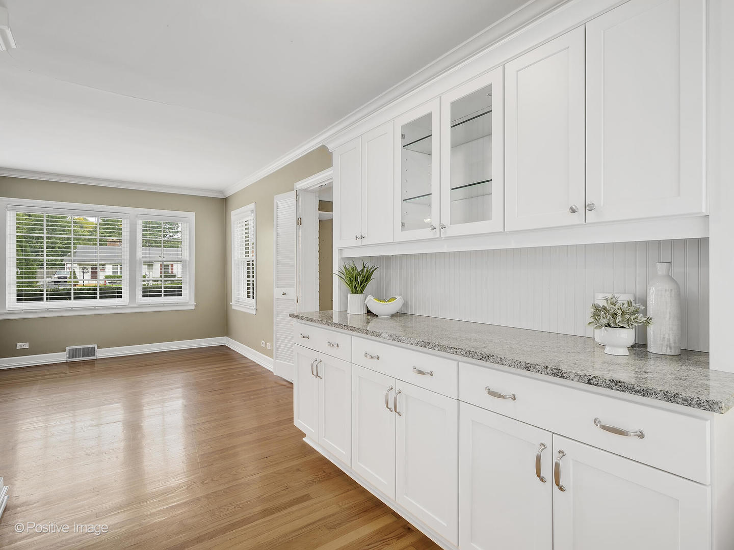 337 Wagner Road Northfield, IL 60093 - Photo 8 of 22 a kitchen with granite countertop white cabinets and a window