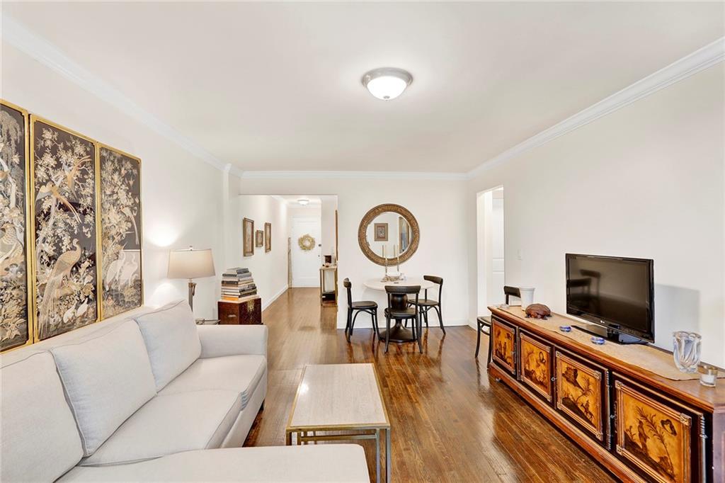 40 89th Street, Unit 4F Brooklyn, NY 11209 - Photo 5 of 22 a living room with furniture and a flat screen tv