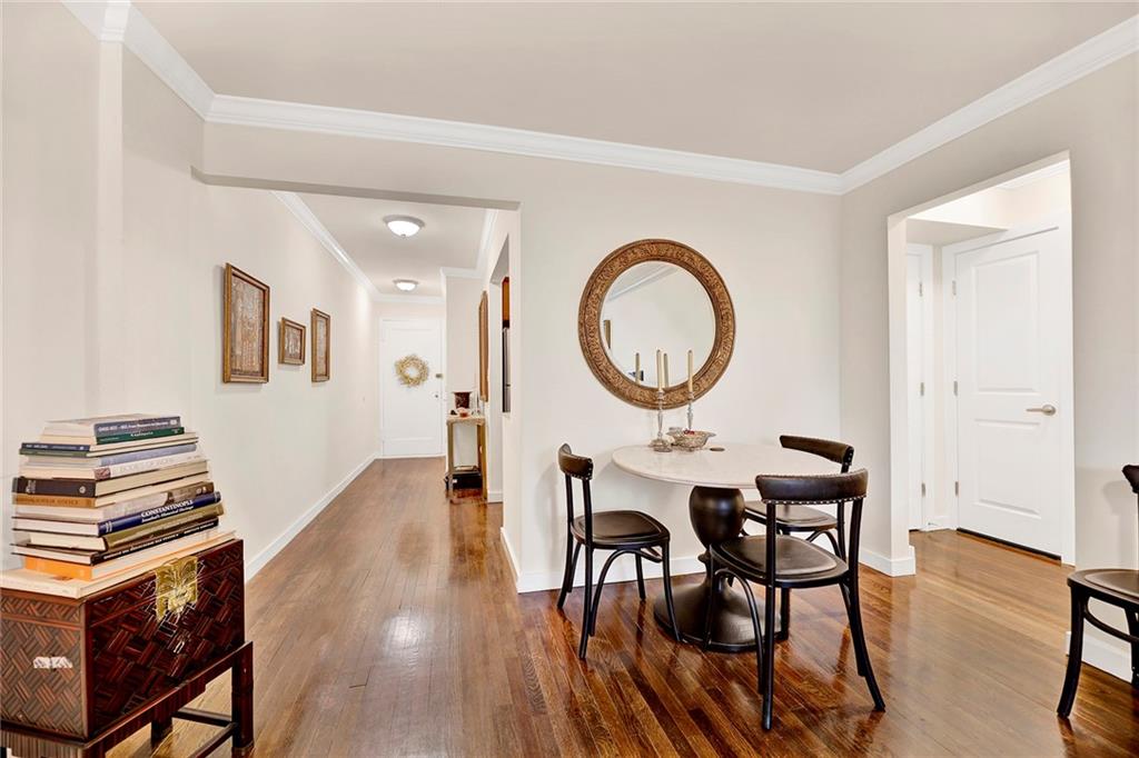 40 89th Street, Unit 4F Brooklyn, NY 11209 - Photo 8 of 22 a view of a dining room with furniture and a mirror