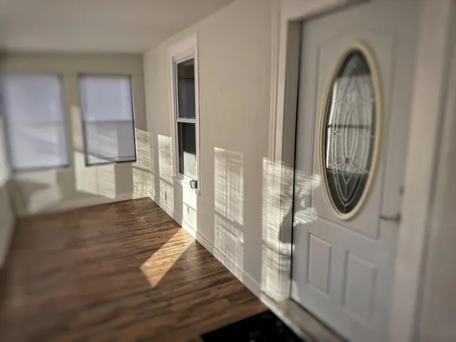 a view of a bathroom with wooden floor