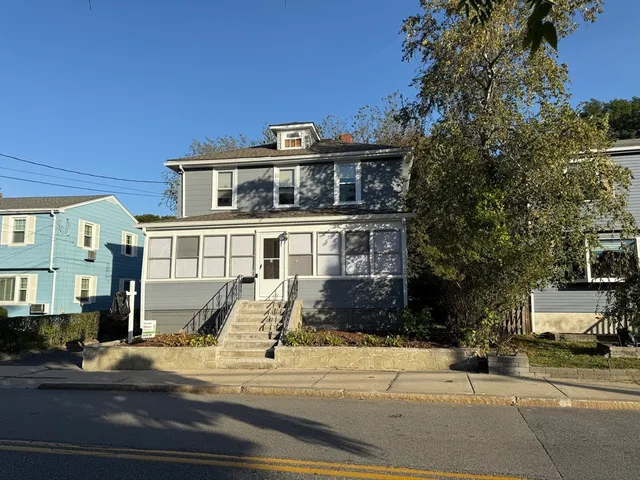 a front view of a building with street view