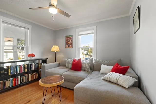 a bedroom with furniture and a book shelf