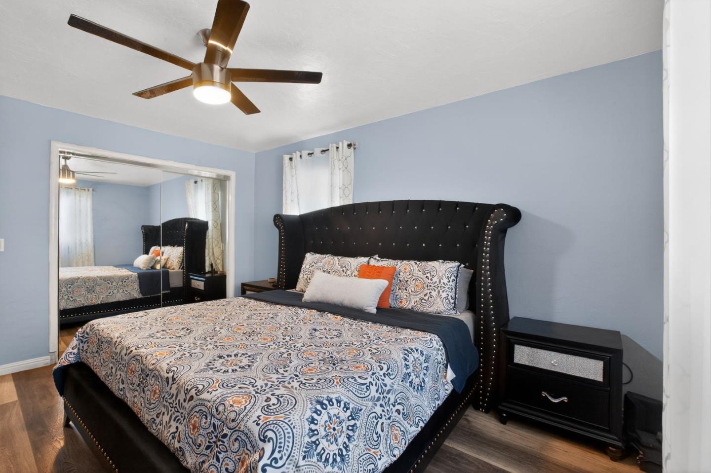 24 Amesti Road Watsonville, CA 95076 - Photo 14 of 27 a bedroom with a bed and a lamp