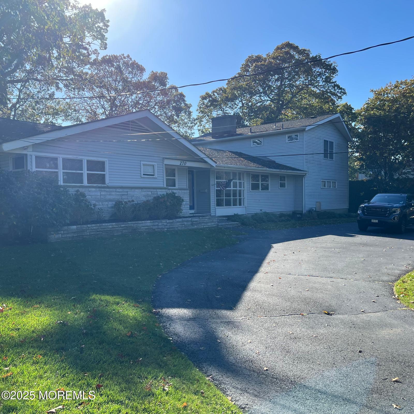 270 Jerome Avenue Oakhurst, NJ 07755 - Photo 1 of 13 a view of a backyard of the house