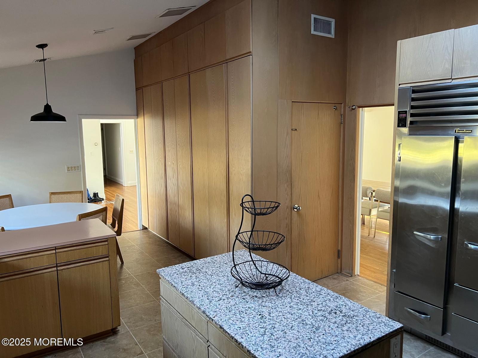 270 Jerome Avenue Oakhurst, NJ 07755 - Photo 4 of 13 a room with a refrigerator and a table