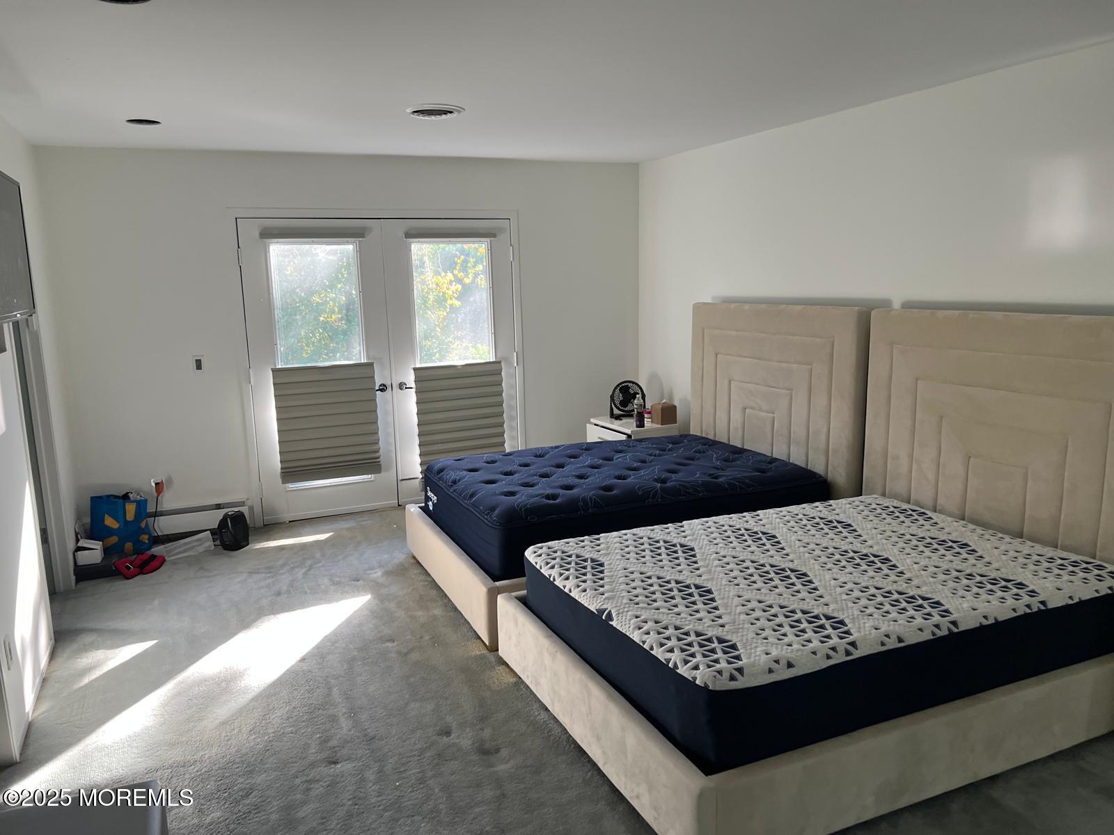 270 Jerome Avenue Oakhurst, NJ 07755 - Photo 6 of 13 a bedroom with a large bed and a window