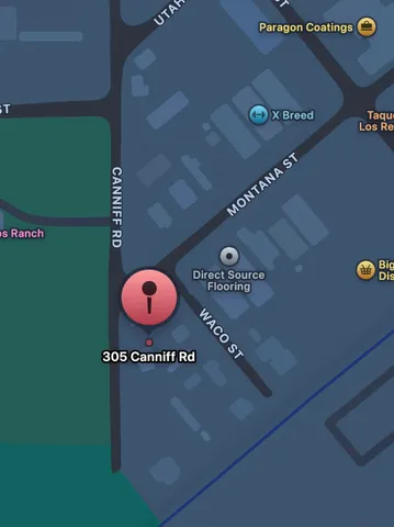 a view of a yard with snow on the road