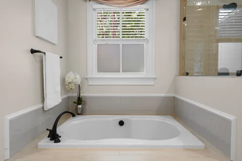 a living room with furniture a window and a fireplace