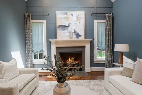 a kitchen with kitchen island granite countertop a sink a counter top space stainless steel appliances and cabinets