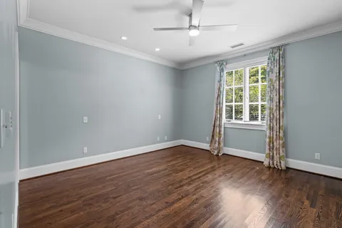a bathroom with a granite countertop sink a toilet and shower