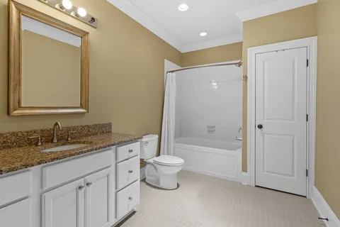a bathroom with a shower and a glass door