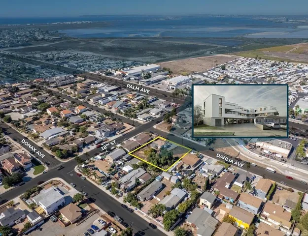 an aerial view of a residential houses with outdoor space