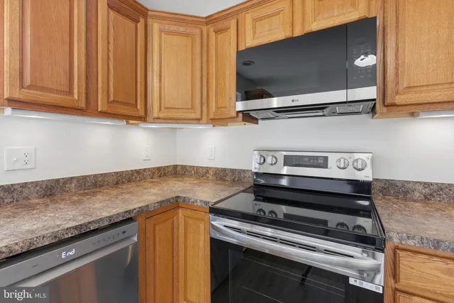 a kitchen with a stove and a microwave