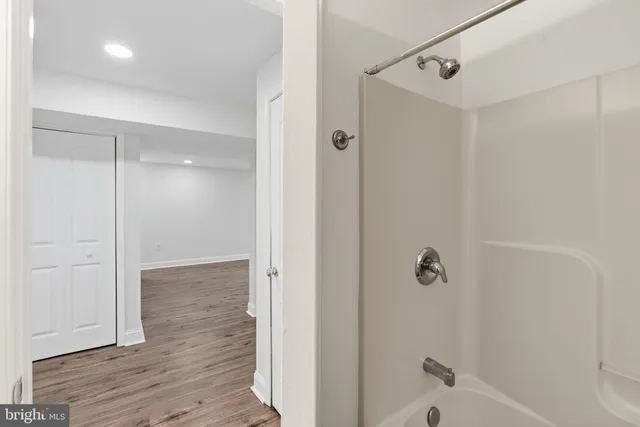 a bathroom with a glass shower door