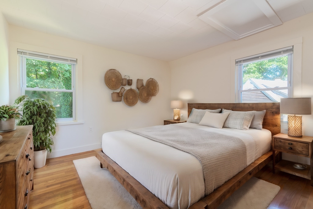 660 Jerusalem Road, Unit 4 Cohasset, MA 02025 - Photo 12 of 20 a bedroom with a bed and a window