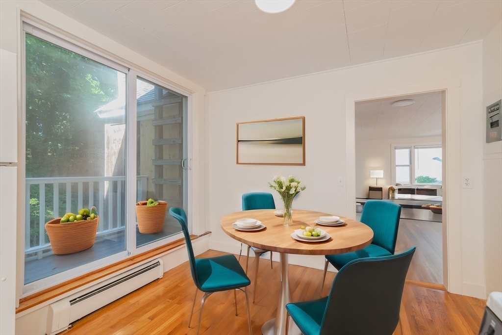 660 Jerusalem Road, Unit 4 Cohasset, MA 02025 - Photo 3 of 20 a view of a dining room with a table and chairs