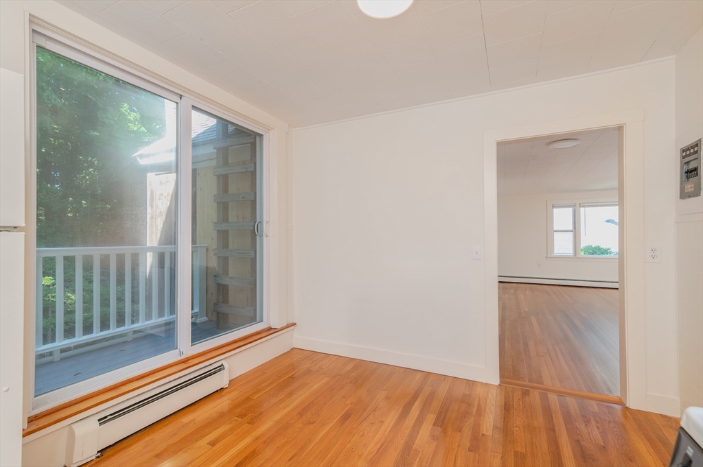660 Jerusalem Road, Unit 4 Cohasset, MA 02025 - Photo 4 of 20 a view of a room with wooden floor and windows