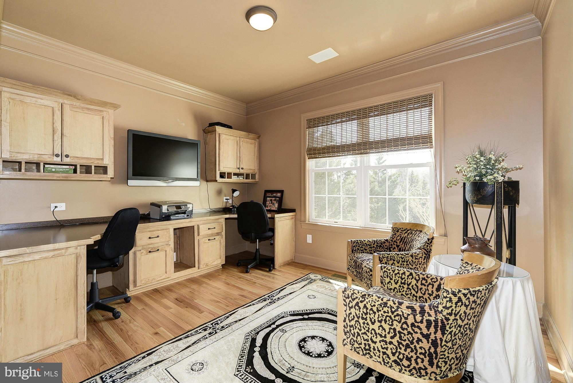 10412 Grey Fox Road Potomac, MD 20854 - Photo 12 of 30 a living room with furniture and a flat screen tv