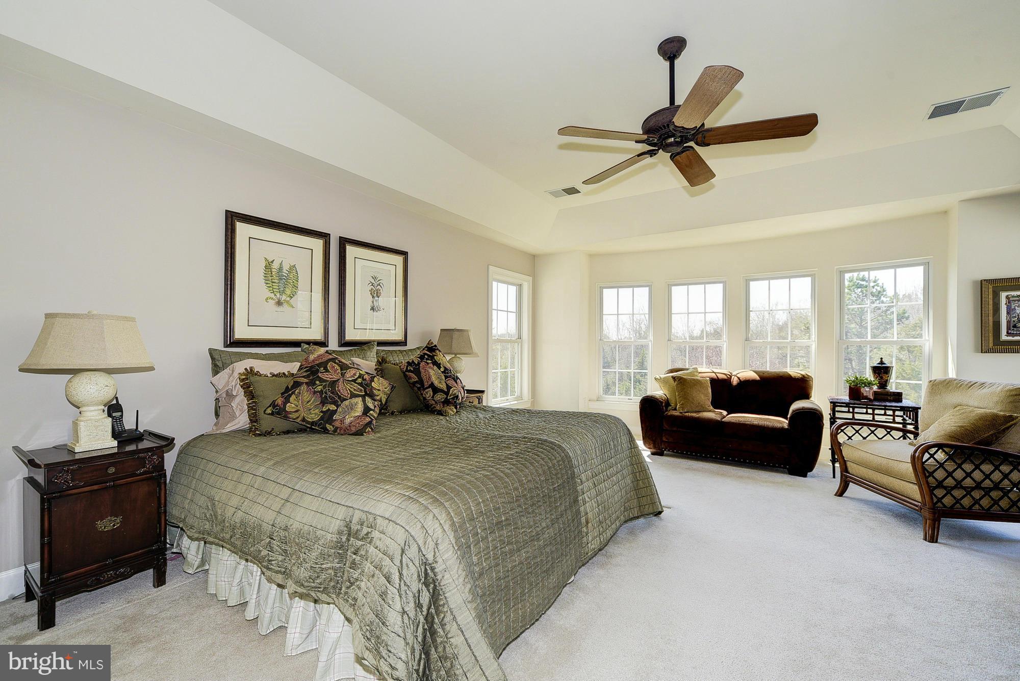 10412 Grey Fox Road Potomac, MD 20854 - Photo 14 of 30 a bedroom with a bed a couch and a window