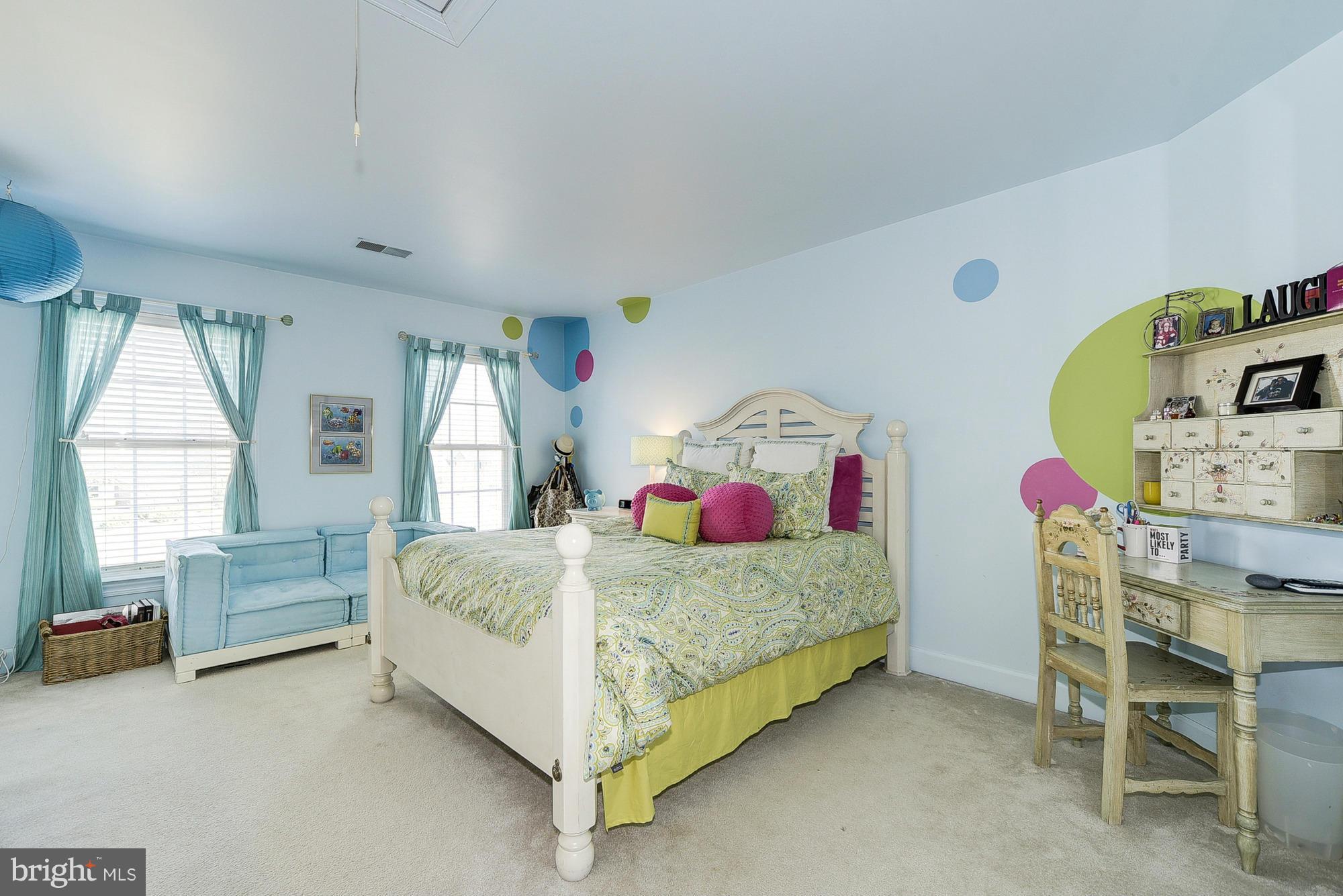 10412 Grey Fox Road Potomac, MD 20854 - Photo 17 of 30 a bedroom with a bed and a furniture