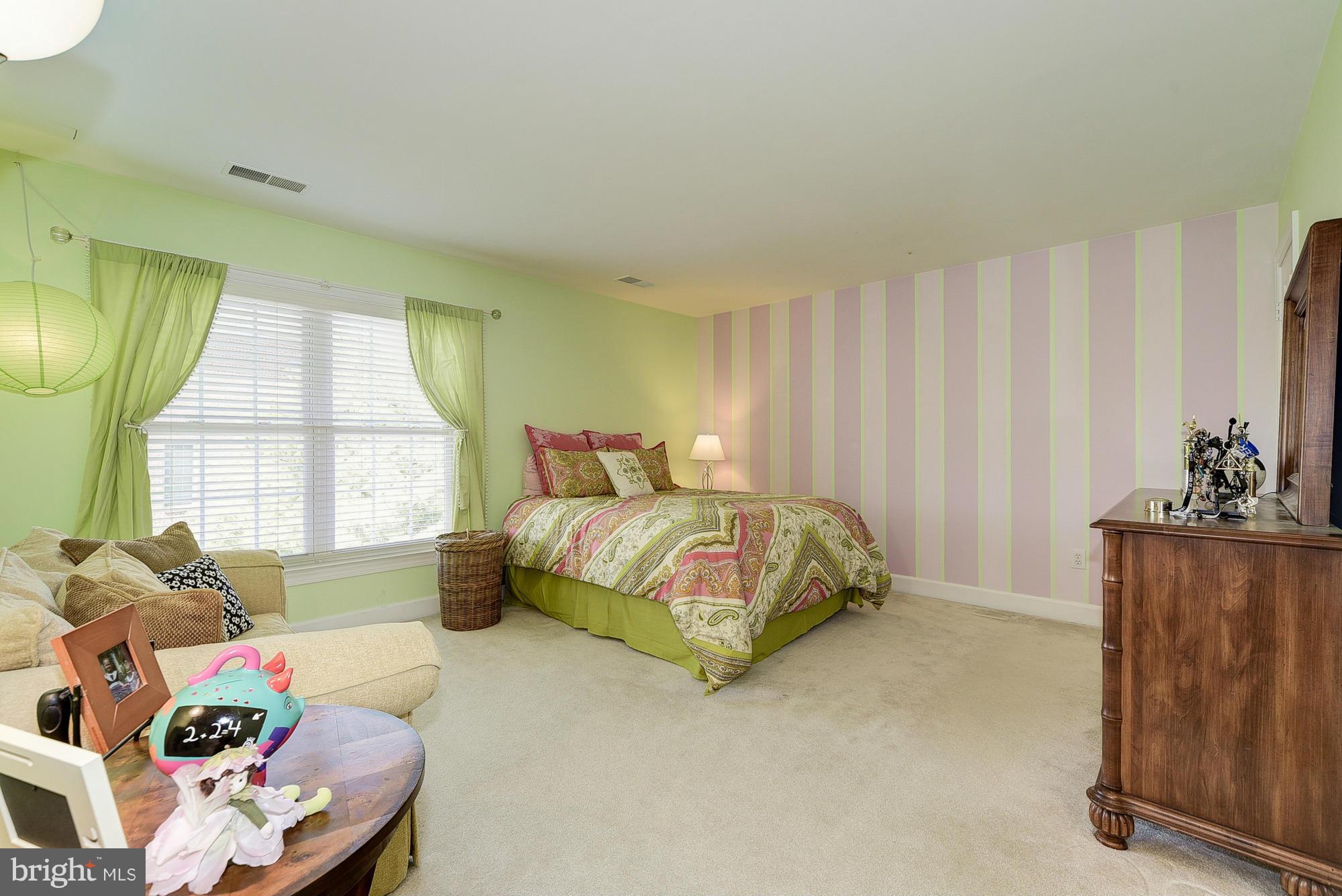10412 Grey Fox Road Potomac, MD 20854 - Photo 18 of 30 a bedroom with a bed and a window