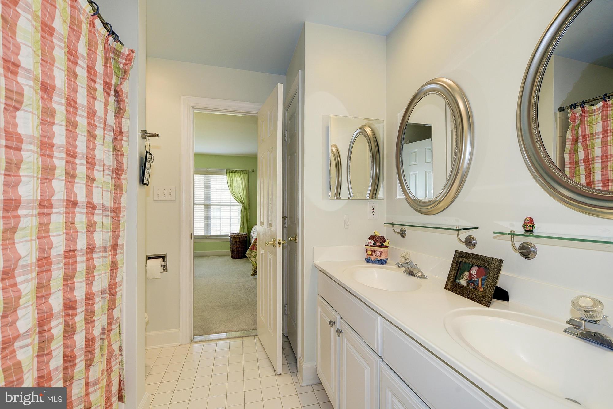 10412 Grey Fox Road Potomac, MD 20854 - Photo 19 of 30 a bathroom with a sink and a mirror