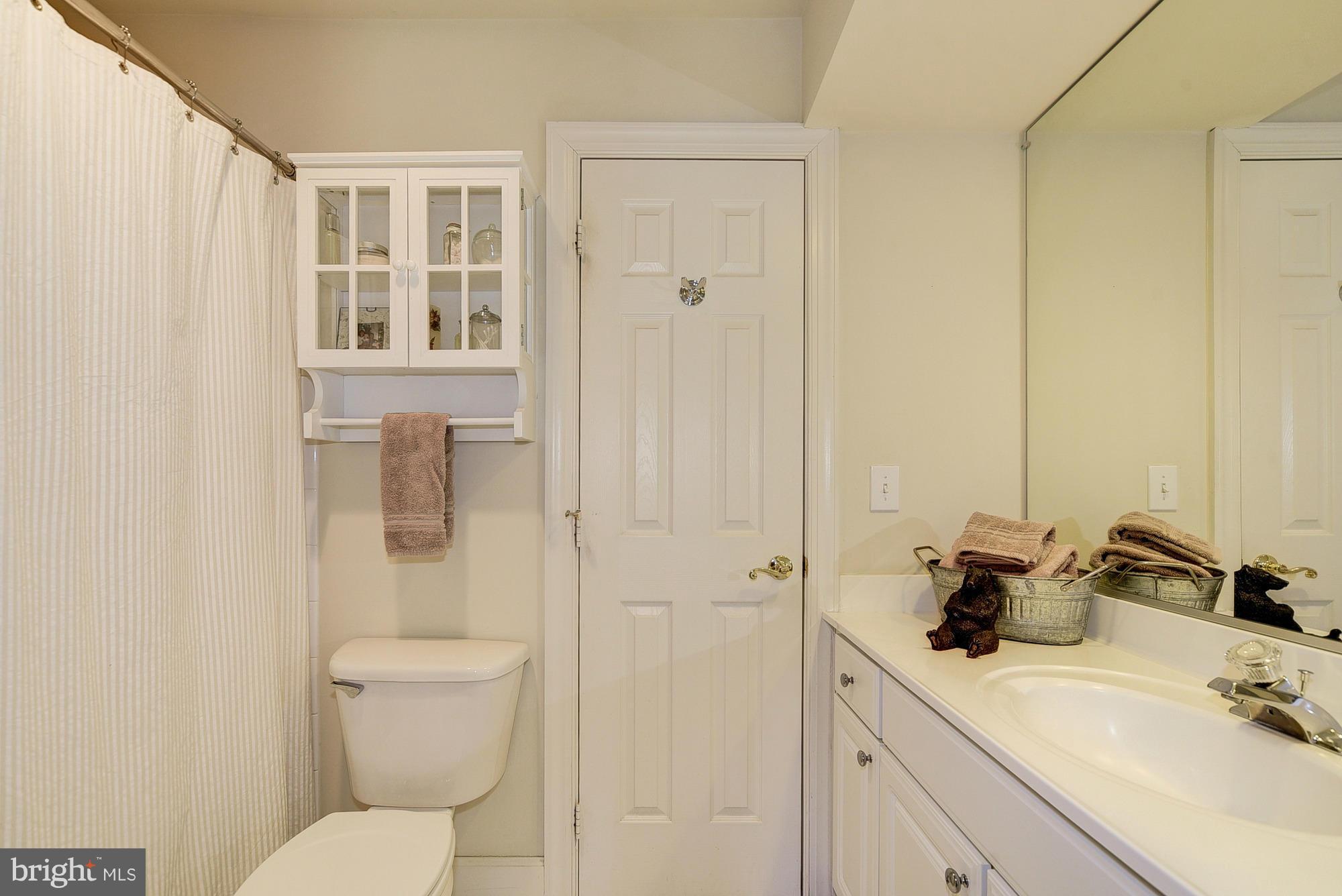 10412 Grey Fox Road Potomac, MD 20854 - Photo 22 of 30 a bathroom with a sink toilet and shower