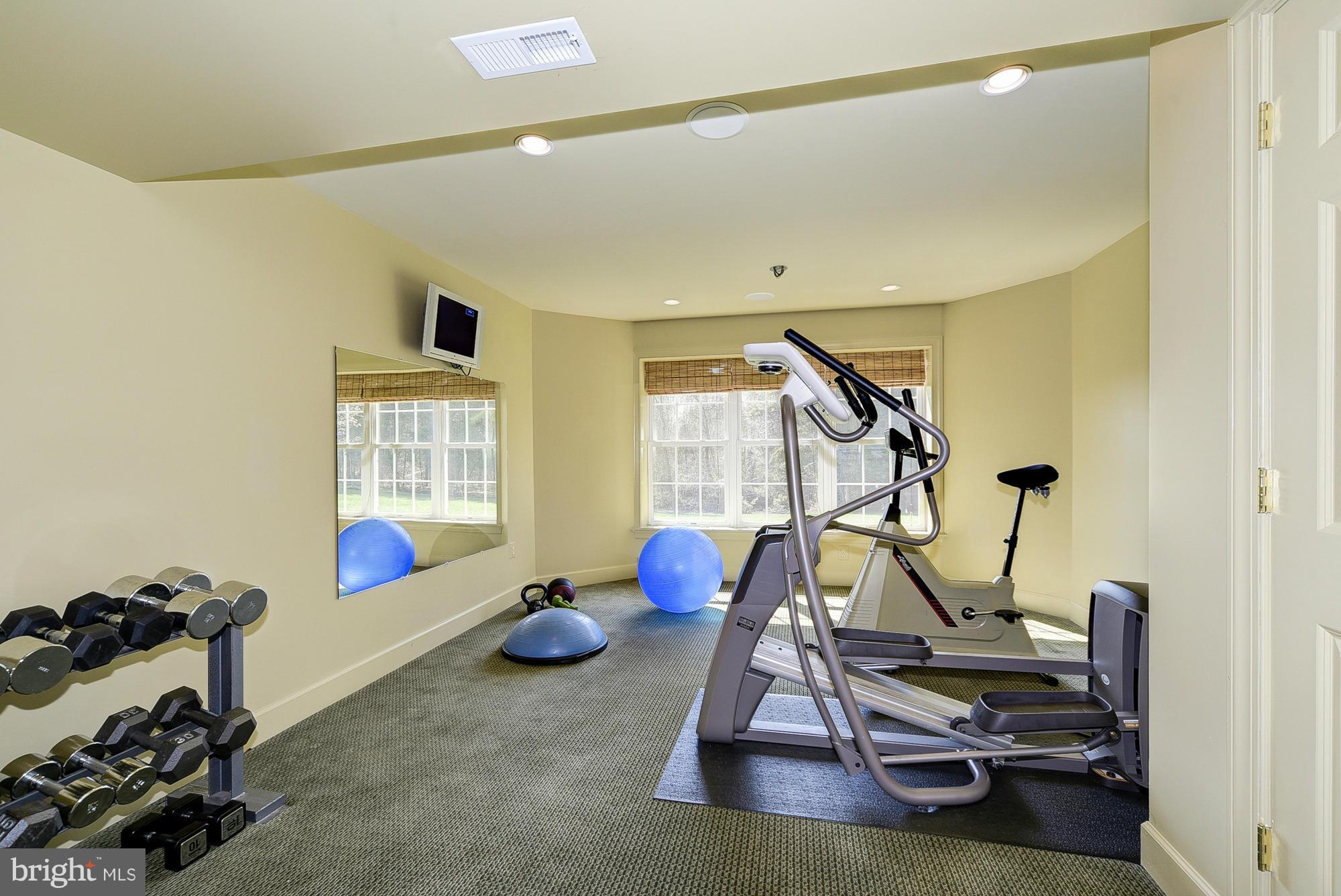 10412 Grey Fox Road Potomac, MD 20854 - Photo 26 of 30 a view of a room with gym equipment