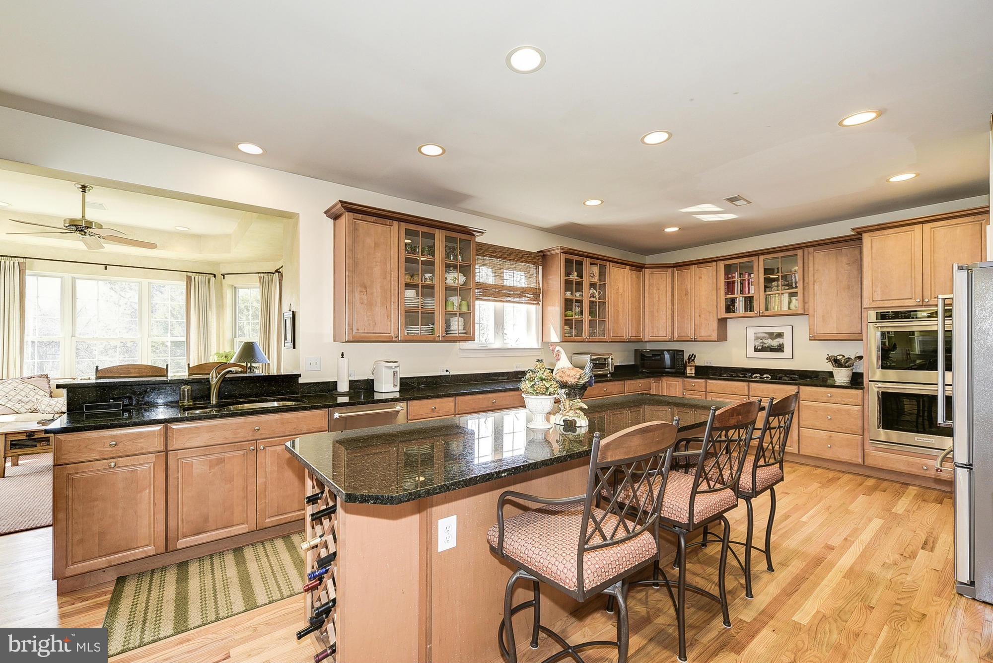10412 Grey Fox Road Potomac, MD 20854 - Photo 9 of 30 a kitchen with granite countertop a sink and cabinets