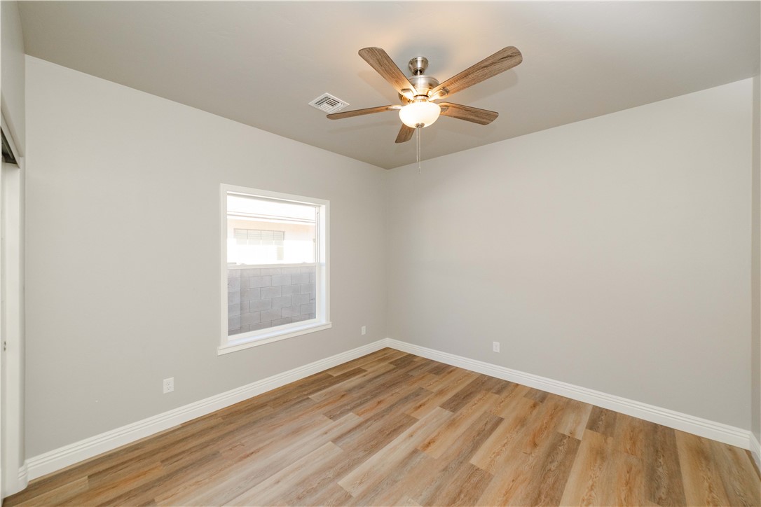 3640 North Kenneth Road Kingman, AZ 86409 - Photo 11 of 44 Empty room featuring light wood-type flooring and ceiling fan