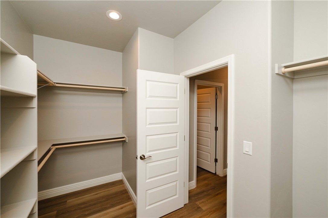 3640 North Kenneth Road Kingman, AZ 86409 - Photo 25 of 44 Spacious closet featuring dark wood finished floors