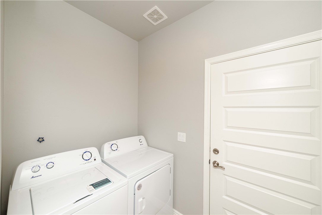 3640 North Kenneth Road Kingman, AZ 86409 - Photo 26 of 44 Laundry room with washer and dryer and baseboards