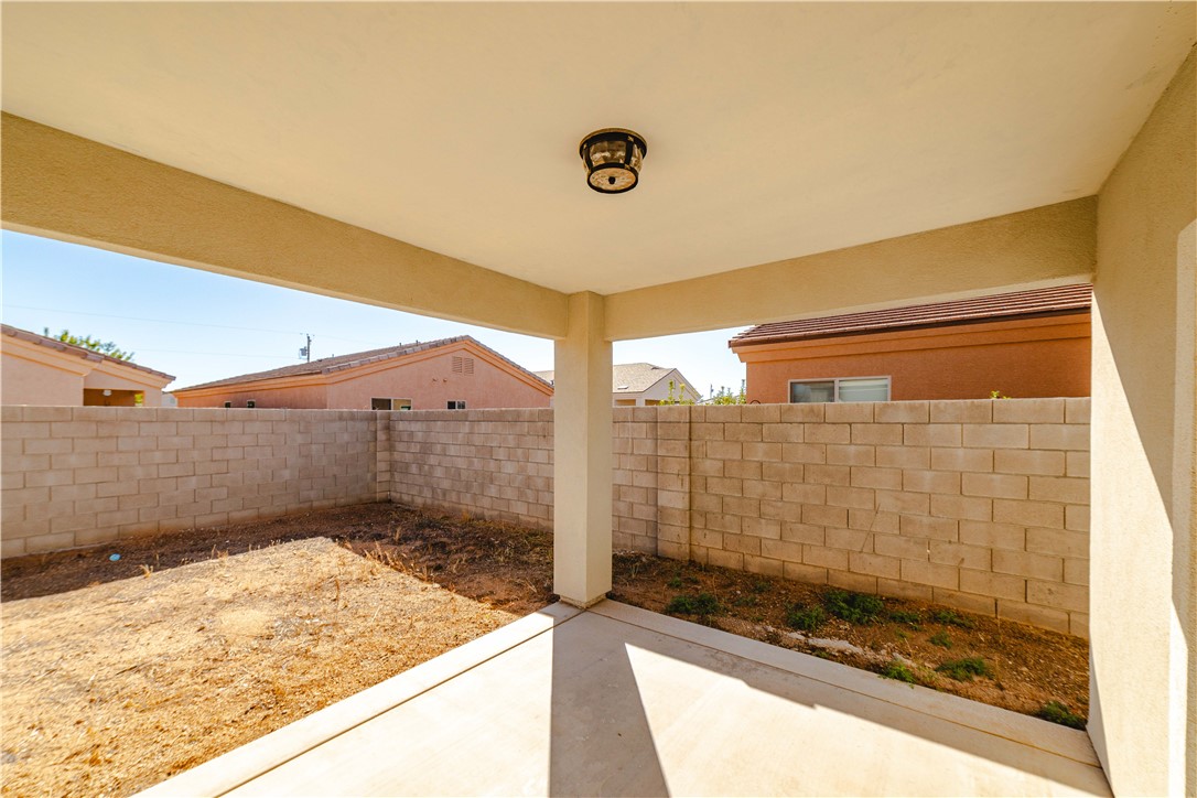 3640 North Kenneth Road Kingman, AZ 86409 - Photo 31 of 44 Fenced backyard featuring a patio area