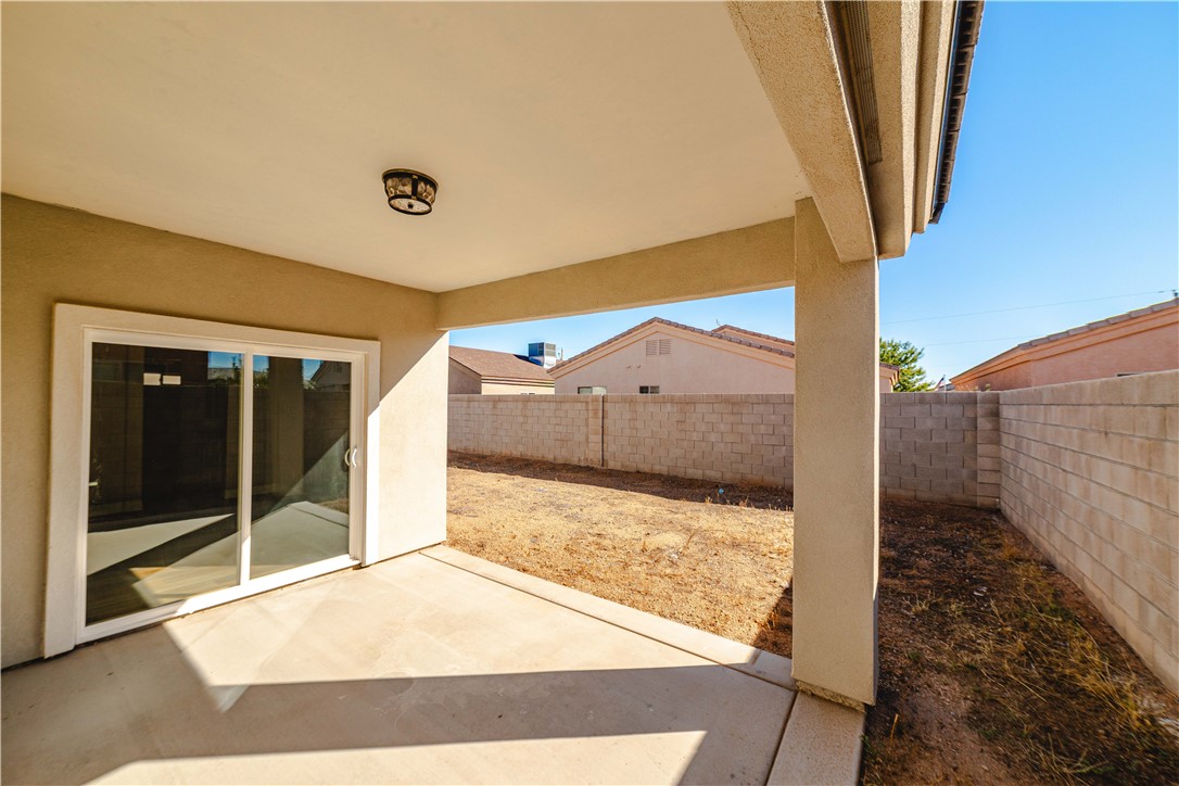 3640 North Kenneth Road Kingman, AZ 86409 - Photo 32 of 44 Fenced backyard with a patio area