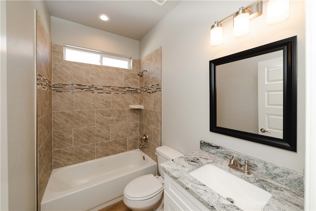 3640 North Kenneth Road Kingman, AZ 86409 - Photo 10 of 44 Bathroom with shower / bath combination, vanity, and recessed lighting