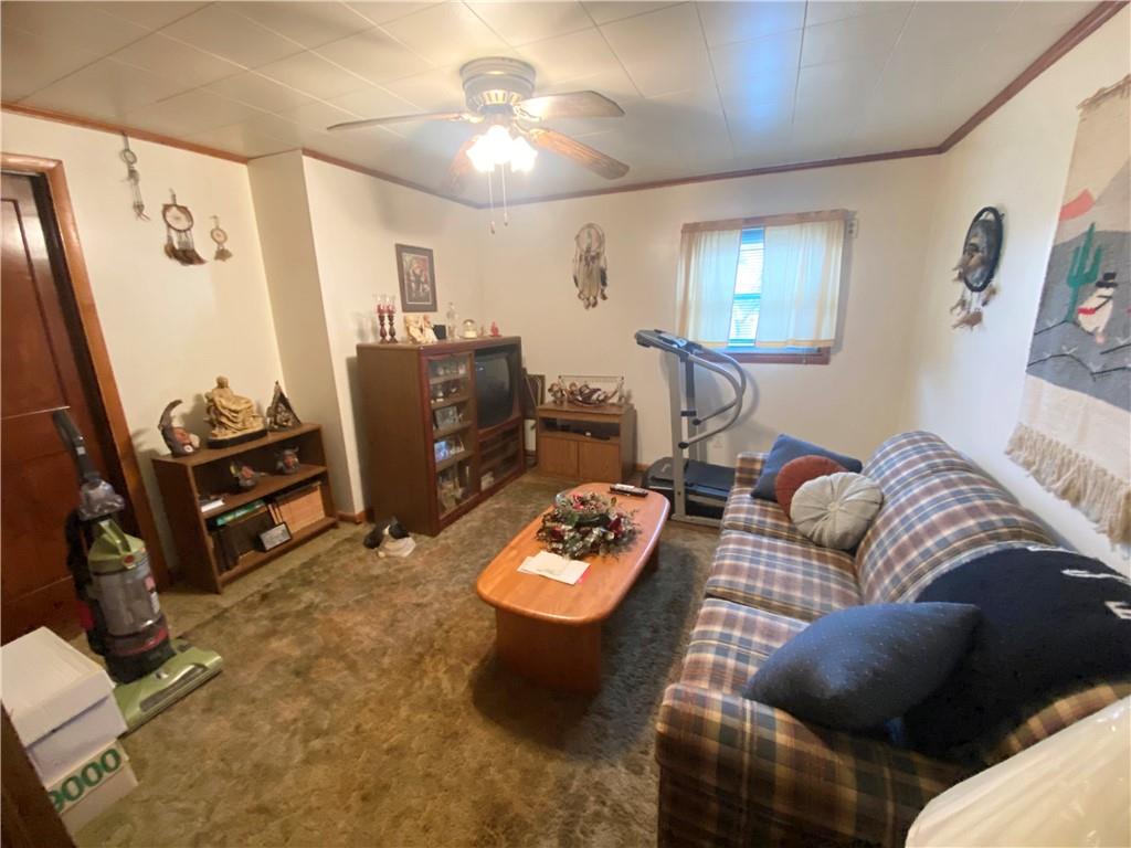 141 Overbeck Street Pittsburgh, PA 15212 - Photo 12 of 20 a living room with furniture and a flat screen tv