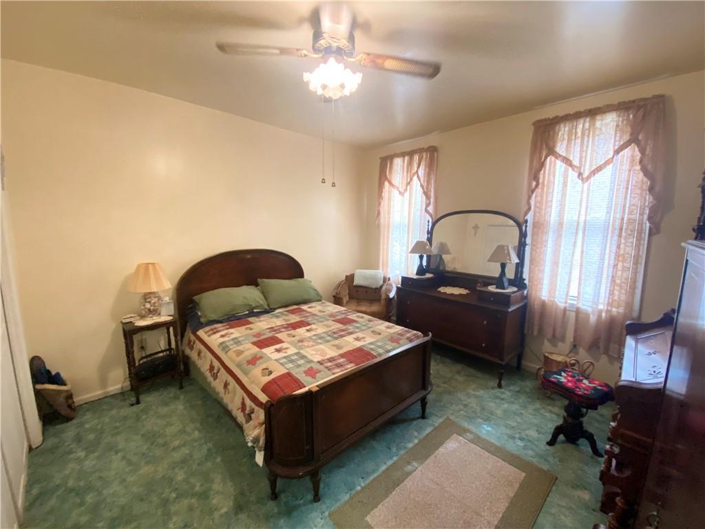 141 Overbeck Street Pittsburgh, PA 15212 - Photo 13 of 20 a living room with furniture and a chandelier