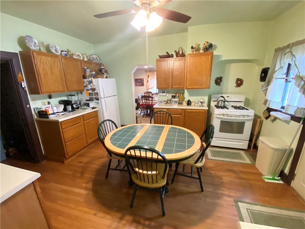 141 Overbeck Street Pittsburgh, PA 15212 - Photo 4 of 20 a living room with furniture a flat screen tv and a table