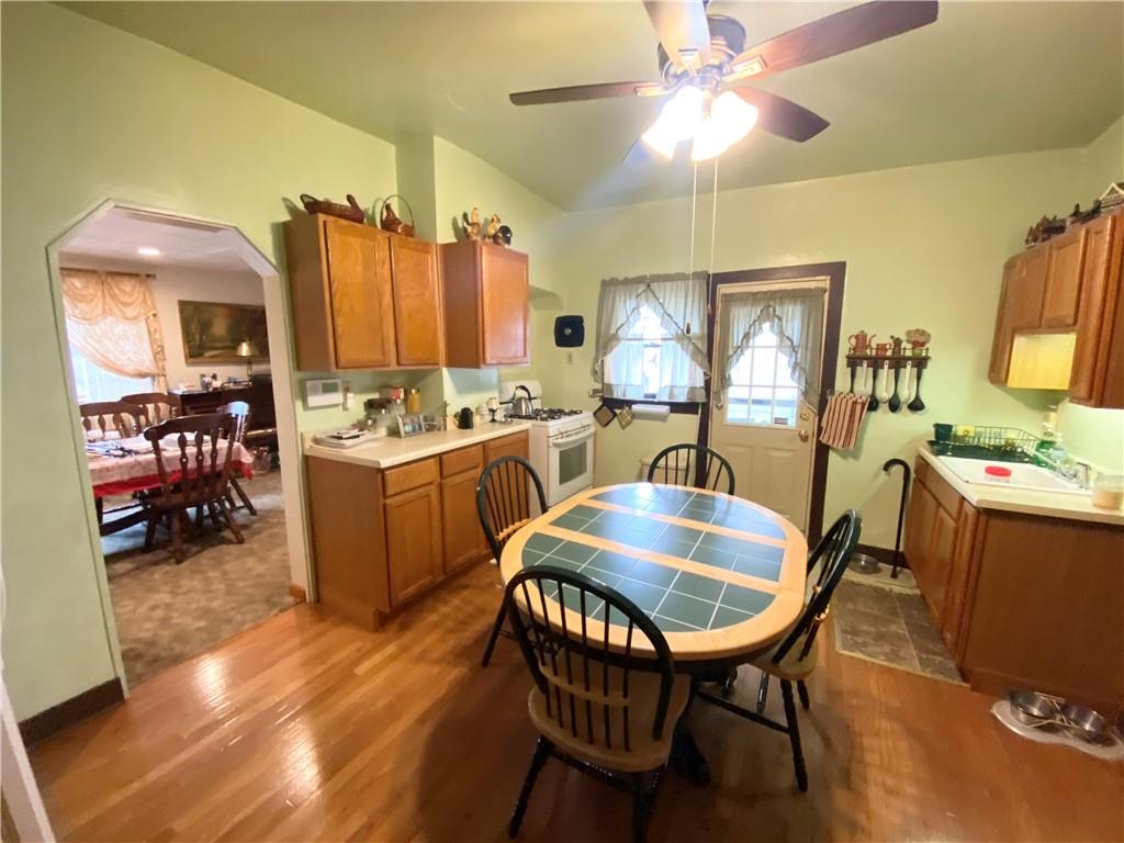 141 Overbeck Street Pittsburgh, PA 15212 - Photo 5 of 20 a view of a dining room with furniture and a livingroom
