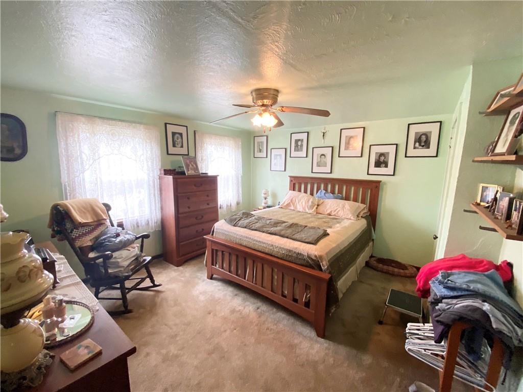 141 Overbeck Street Pittsburgh, PA 15212 - Photo 10 of 20 a bedroom with a bed and furniture