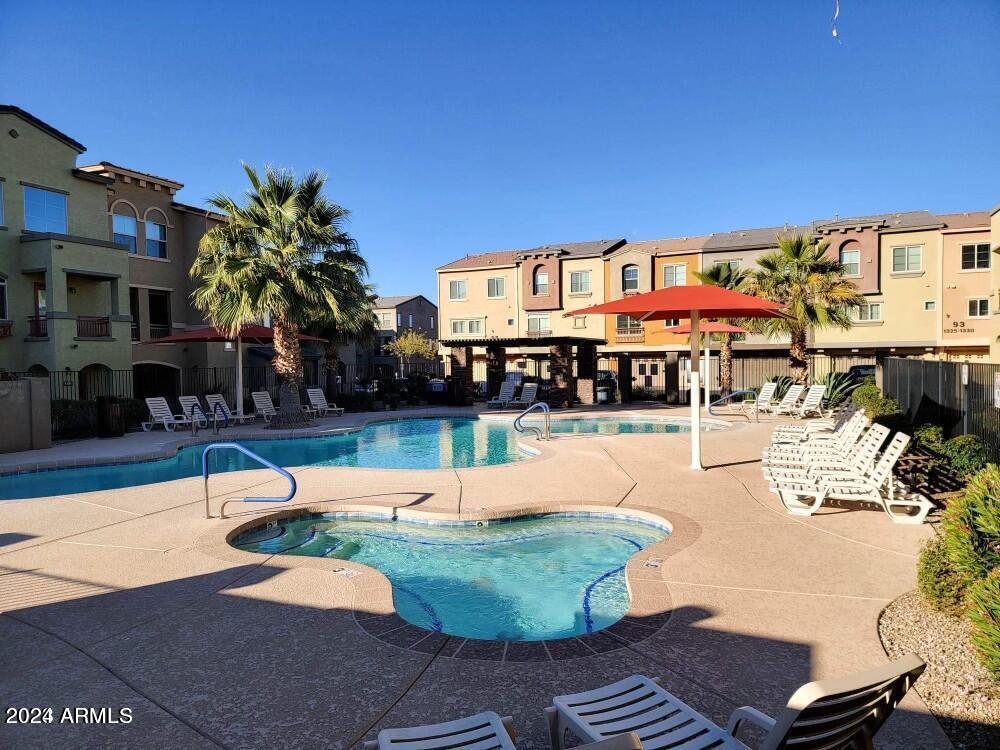 2150 West Alameda Road, Unit 1169 Phoenix, AZ 85085 - Photo 4 of 26 a swimming pool with outdoor seating and yard