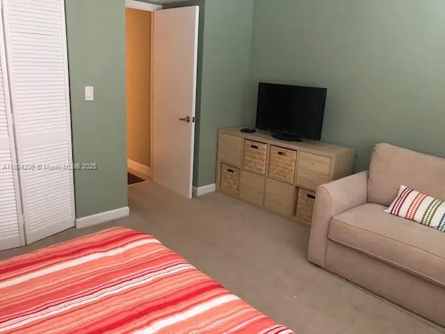 a bathroom with a shower and toilet