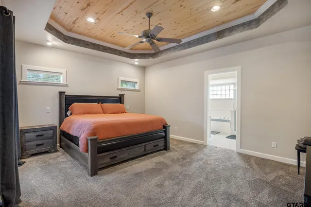 a bed sitting in a room next to a window