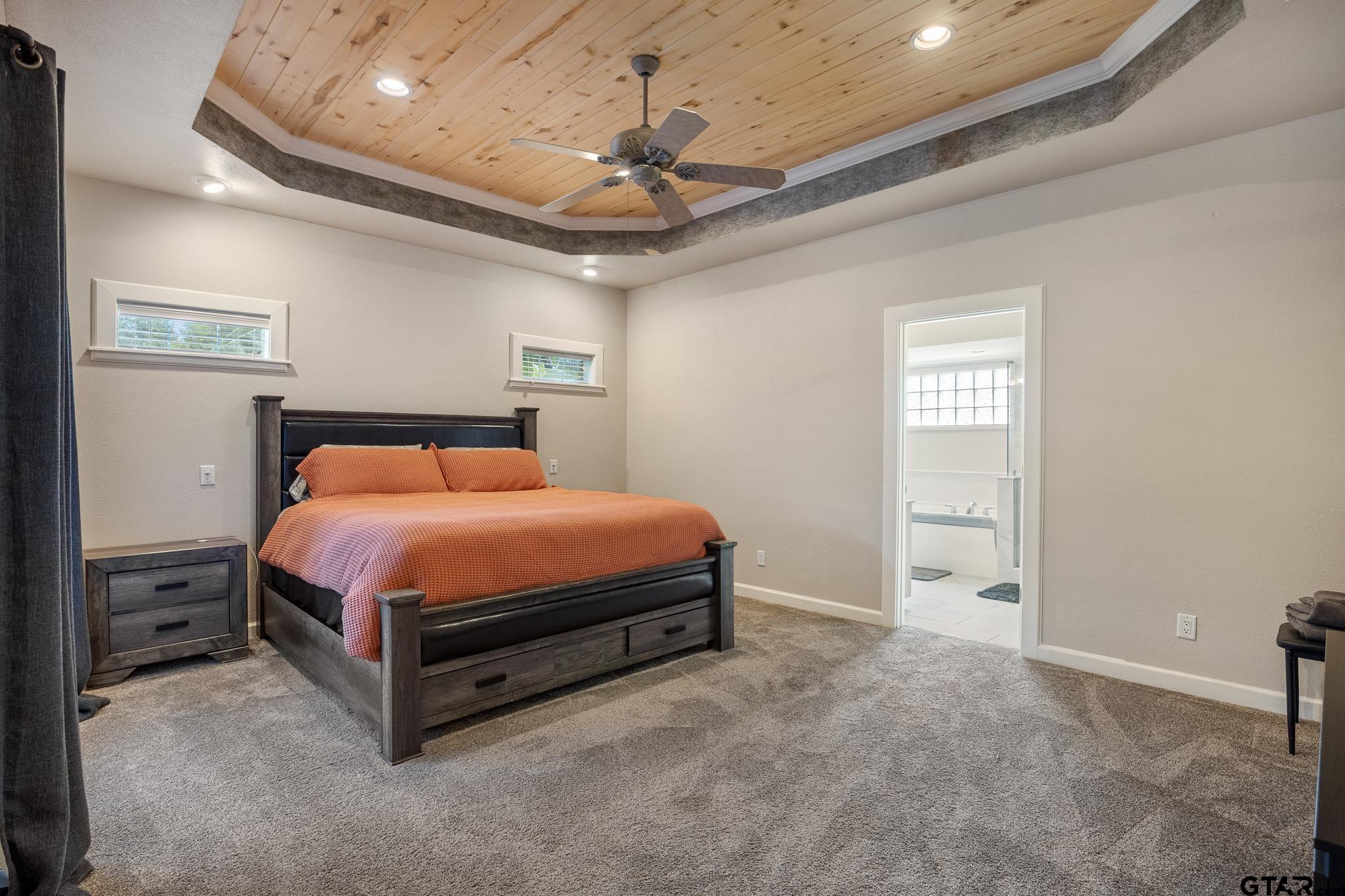 344 Antler Road Longview, TX 75605 - Photo 15 of 45 a bed sitting in a room next to a window