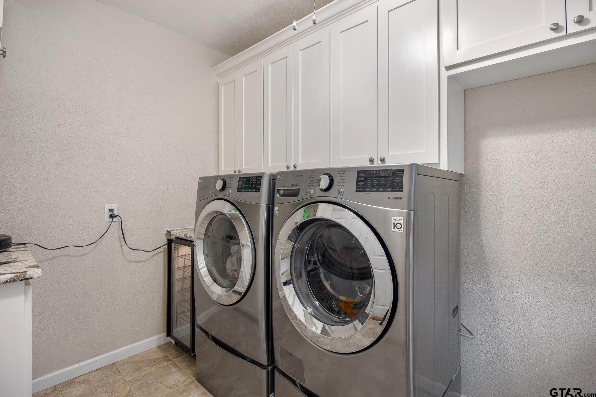 344 Antler Road Longview, TX 75605 - Photo 22 of 45 a utility room with dryer and washer