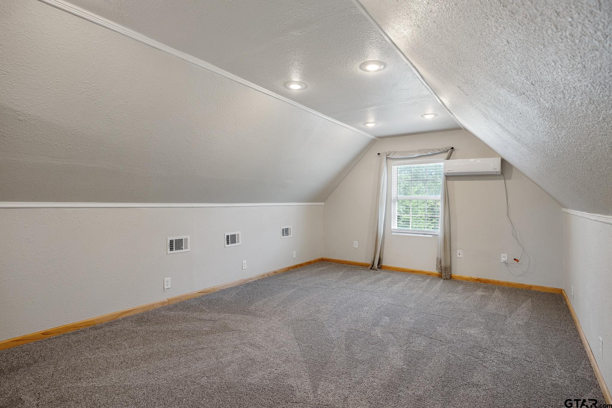 344 Antler Road Longview, TX 75605 - Photo 23 of 45 an empty room with windows