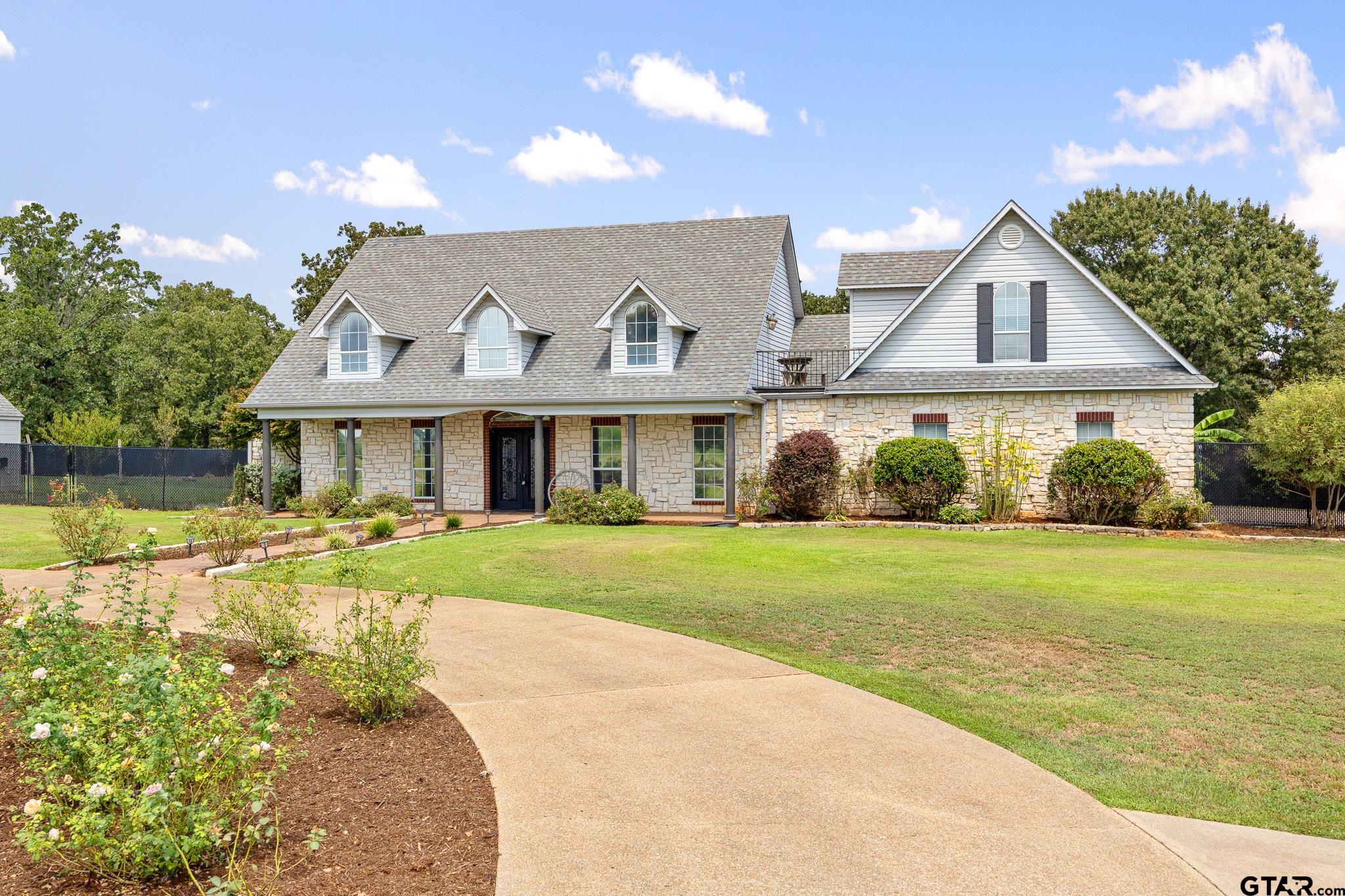 344 Antler Road Longview, TX 75605 - Photo 3 of 45 a front view of house with outdoor space and swimming pool